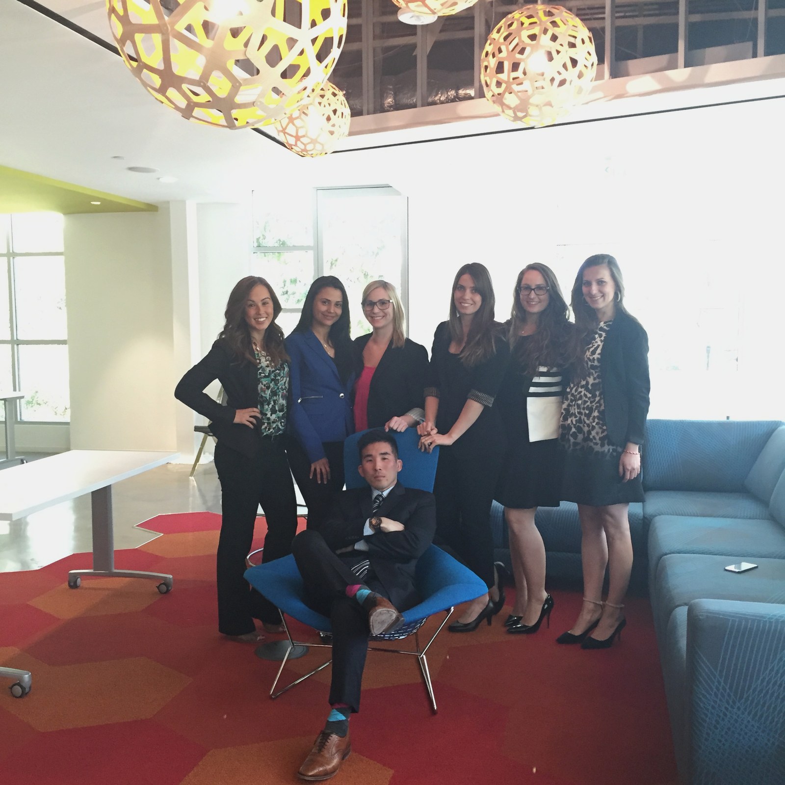 Tim Hirata with the Cydcor team in an office lobby
